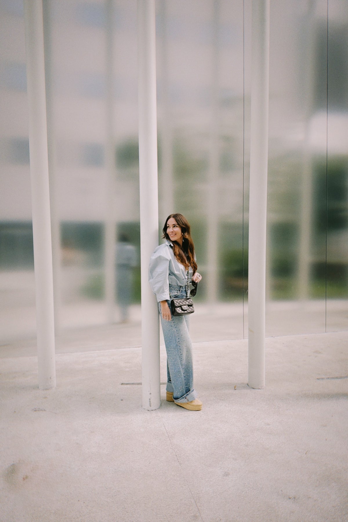 Cara Woodhouse among architectural columns