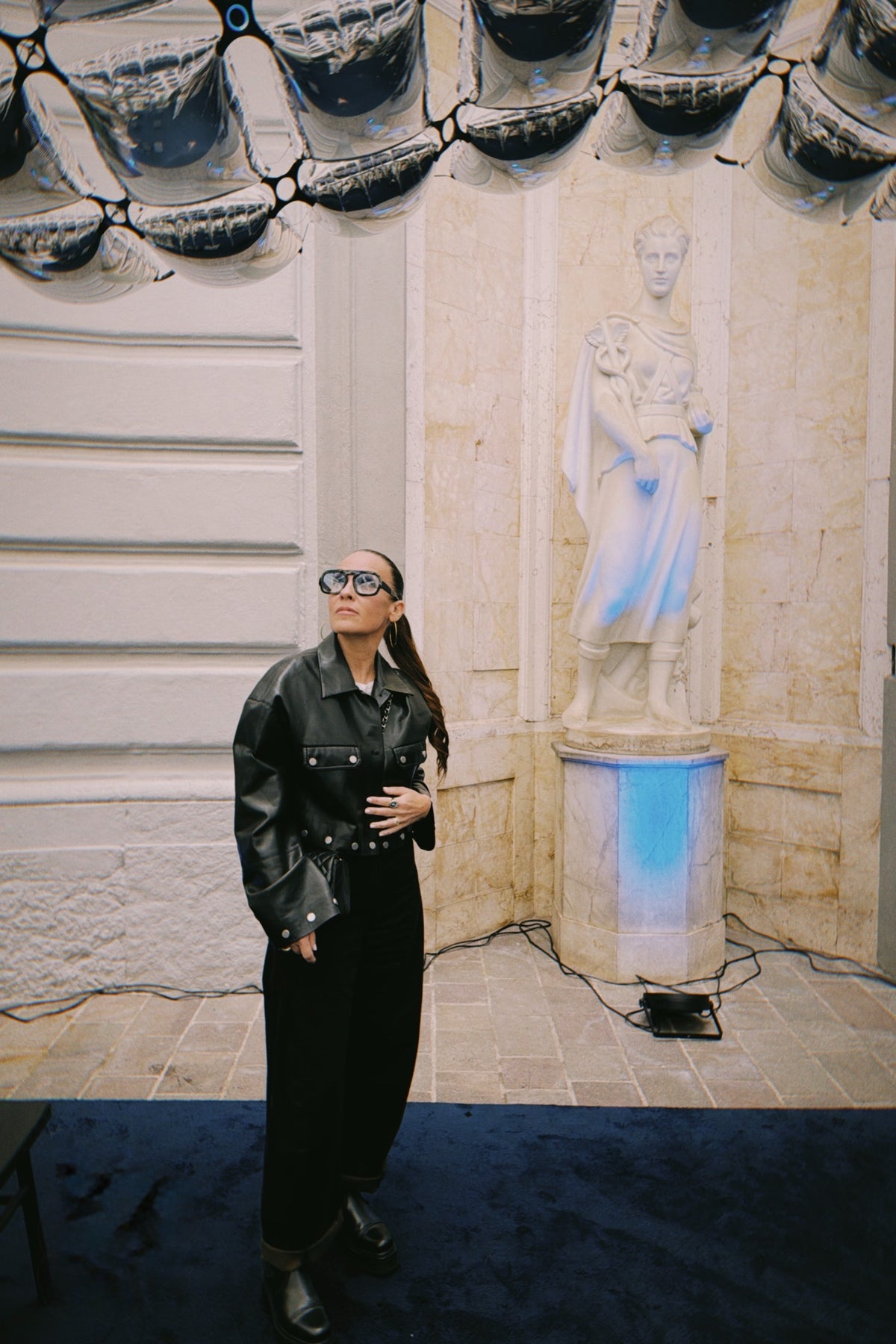 Cara Woodhouse viewing a sculptural installation